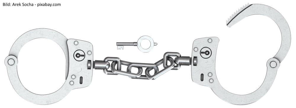 Symbolbild: Handschellen und Schlüssel